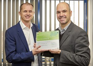 Andrew Copson, MD UK, Middle East and Australia, LINPAC, receiving the ServiceMark accreditation